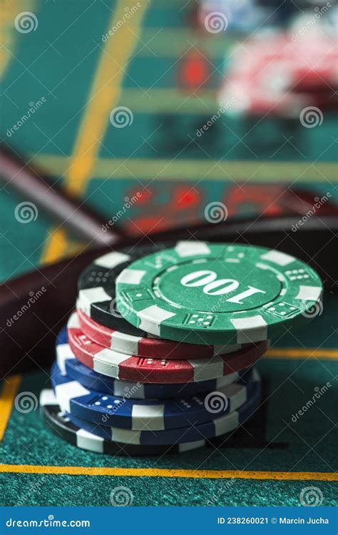 pile of chips in the center of a poker table